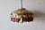 Tiffany-style stained glass pendant light featuring a fruit and leaf motif (such as the Meyda Tiffany Fruit pendant...