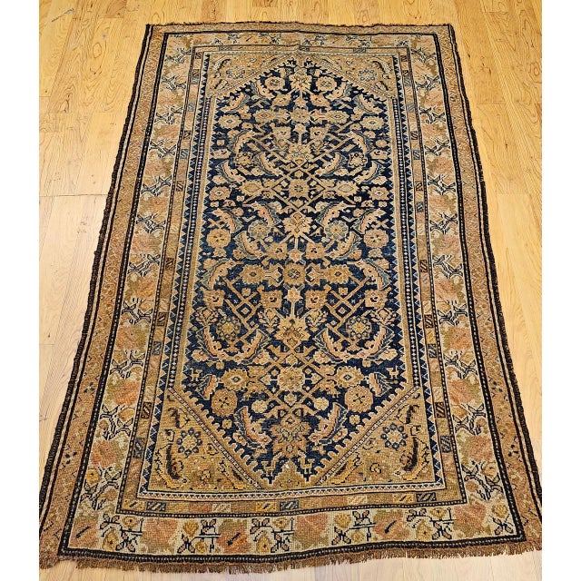 "This late 19th century Persian Malayer rug from the fourth quarter of the 1800s features a sophisticated allover Herati...
