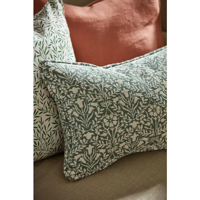 Originally a best-selling carpet design this mixed-chenille jacquard fabric features a small-scale interlocking floral...