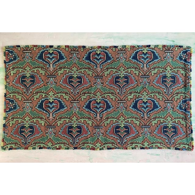 A captivating pomegranate tapestry featuring twisted chain stitch embroidery by Edna Nihlén, crafted in Sweden in 1956....