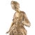 A French late 19th century figural bronze of a maiden in an 18th century ball gown. She is standing atop a circular...