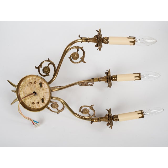 Spectacular 1950s Spanish French Neoclassical Style Cast Brass 3-Light Wall Sconce. Masterfully handcrafted in Spain circa...