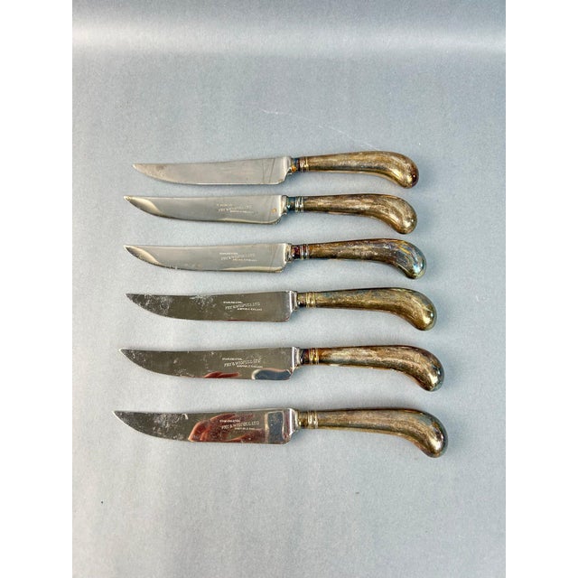 A set of six vintage knives with steel blades and silver-plated pistol handles. Made by Fry and Wigfull, Sheffield,...