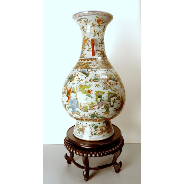 Chinese porcelain Taoist practices yuhuchunping, a large, fencai, pear shape vase with a white glazed exterior, interior...
