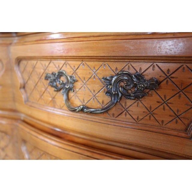 Hand-carved chest of drawers in the Louis XV style with cast iron fittings. A beautiful piece of honest furniture from the...