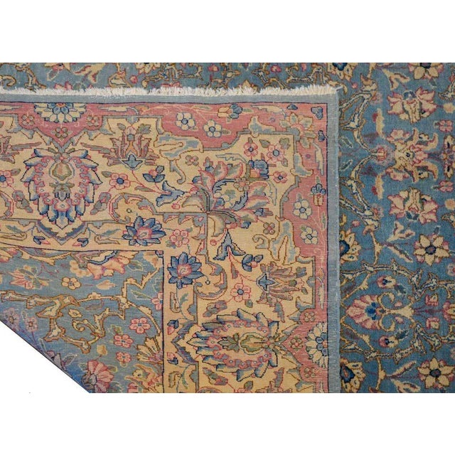 A wonderful early 20th century Persian Kirman rug with a floral lattice pattern woven in dreamy colors of pink, fuchsia,...