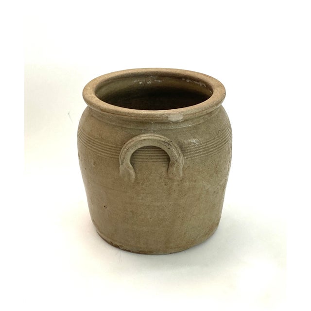 Smaller traditional French stoneware confit with lamb's ear handles was used to preserve meats such as duck or goose. The...