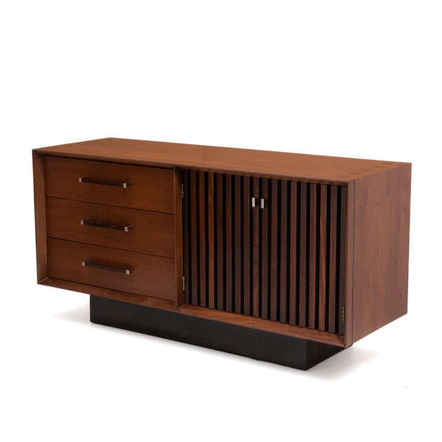 A Lane "Tower Suite" credenza with three drawers and a two door cabinet that opens to reveal a large storage space with...