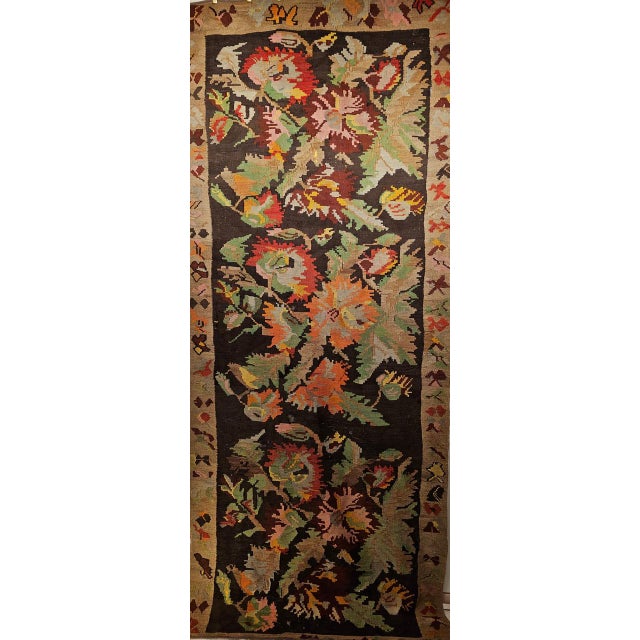 A vintage Karabagh kilim runner of outstanding color and vitality from the second quarter of the 20th century, featuring...
