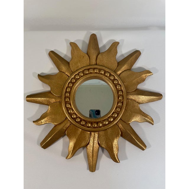 A stunning vintage French style Giltwood Sunburst Wall Mirror with classic alternating lengths of rays and beading...