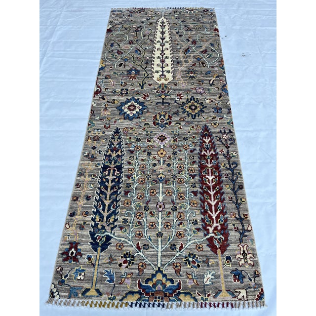 A garden runner in the cypress Tree of Life design, hand-knotted in northern Afghanistan from fine hand-spun Ghazni wool....
