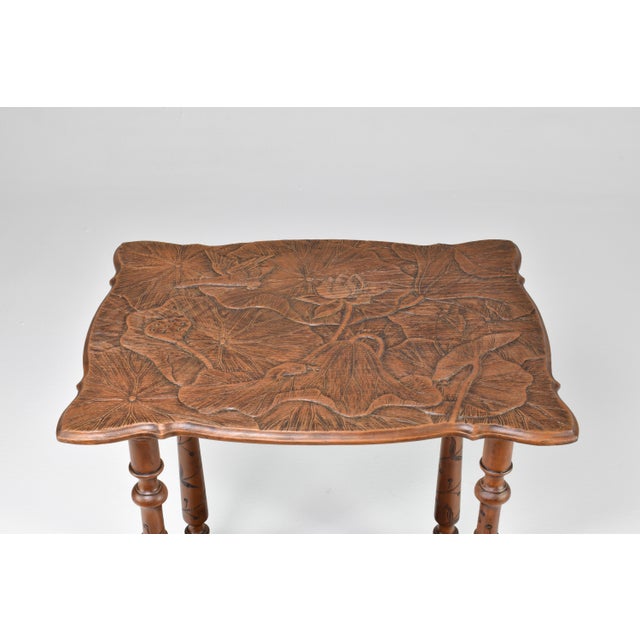 Experience the elegance of this tea table, reminiscent of the distinguished designs imported by the English firm, Liberty...