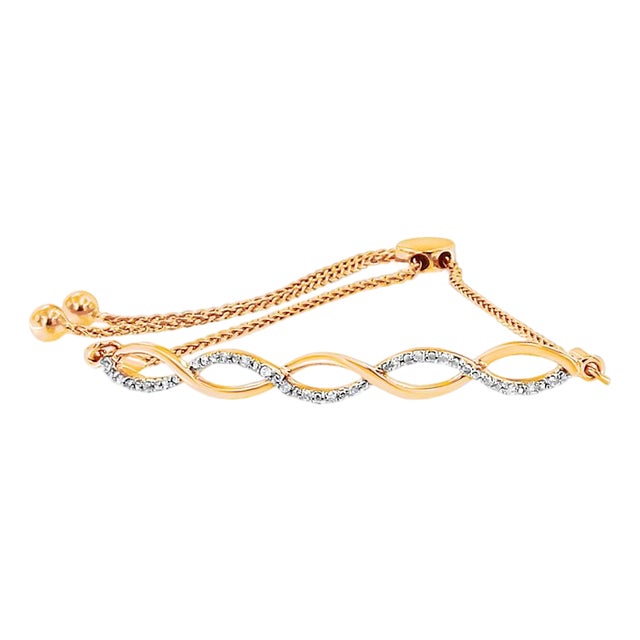 14K Yellow Gold Plated .925 Sterling Silver 1/10 cttw Diamond Infinity Twist 4”-10” Adjustable Bolo Bracelet (I-J Color, I2-I3 Clarity) For Sale