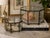 A beautiful vintage pair of handcrafted Mexican brass and glass display boxes featuring elegant octagonal forms and...