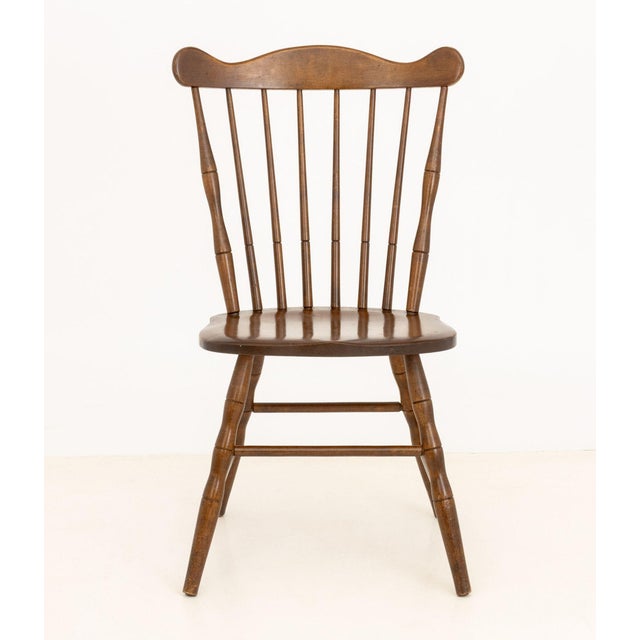 Conant Ball Windsor Style Maple Side Chair, with spindle back, marked "Conant Ball / Furniture Makers" to underside. 34.5"...