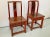 Pair of red Chinese wood side chairs. Great unique carving details on each chair. Not a true pair but are being sold as a...