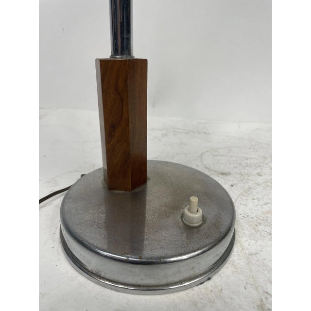 Elegant Anat-jour from the 50s, in metal and wood, with worked glass lampshade. The lamp is equipped with a foldable metal...