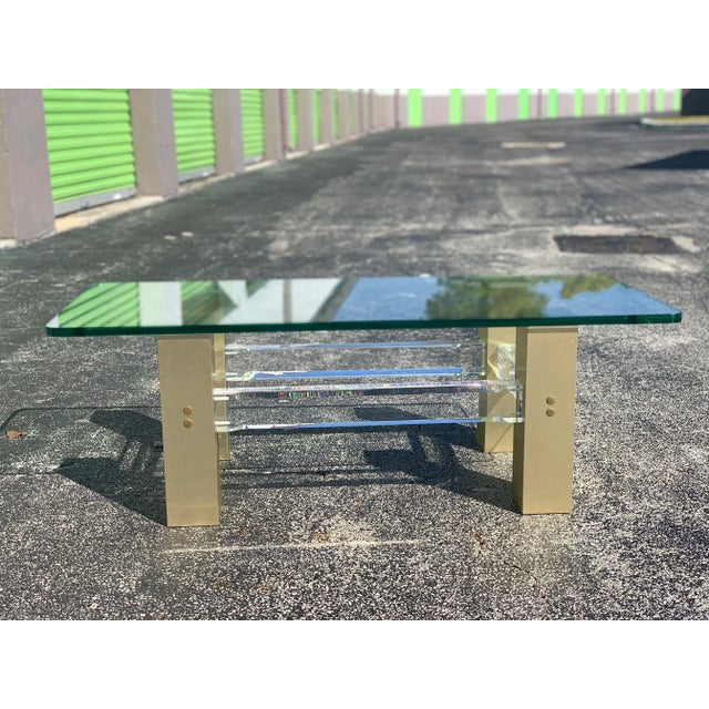 Beautiful vintage lucite coffee table. Base is heavy and sturdy, lucite in good condition with only minimal signs of wear....