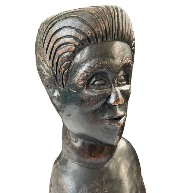 A striking vintage hand-carved wooden sculpture bust, signed by the artist “Roy.” This piece depicts a man's head and...