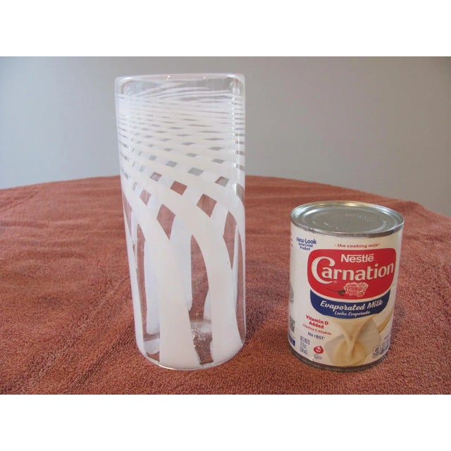 This is a 7.5" tall blown glass cylinder vase made by British artist Anthony Stern. This vase features 1/8" thick walls...