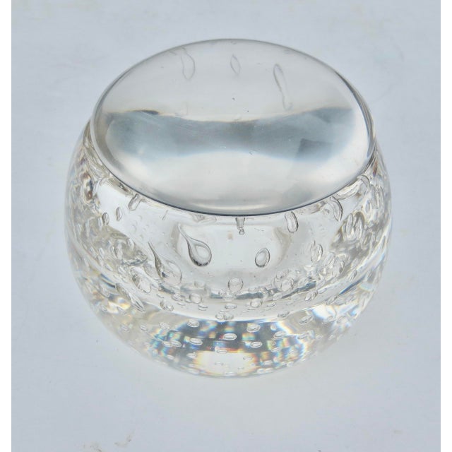 Crystal globe bowl with Clear lid capping the bowl into a globe. Designed with air-bubble grid pattern over the sides and...