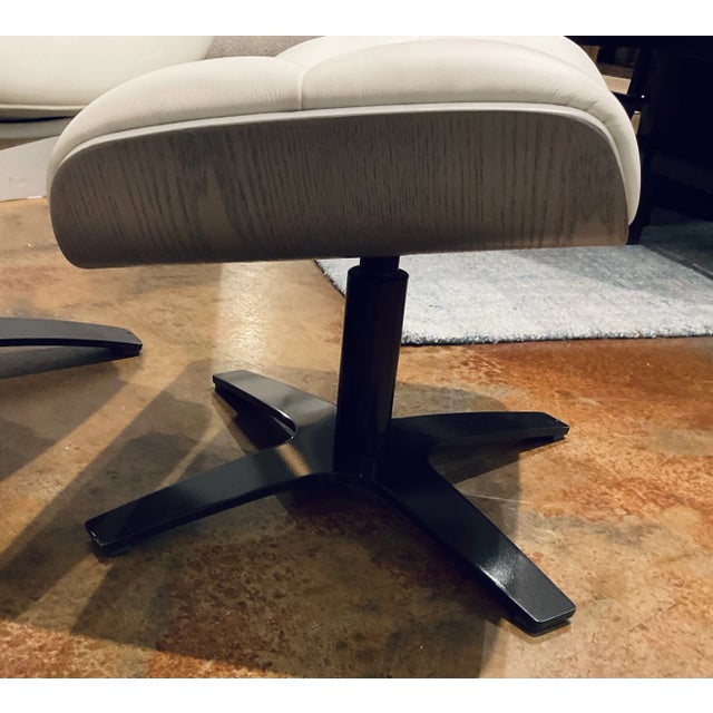 Timeless Mod Eames Style Italian White Leather Lounge Chair and Ottoman, gray wood frame, black metal base, showroom floor...