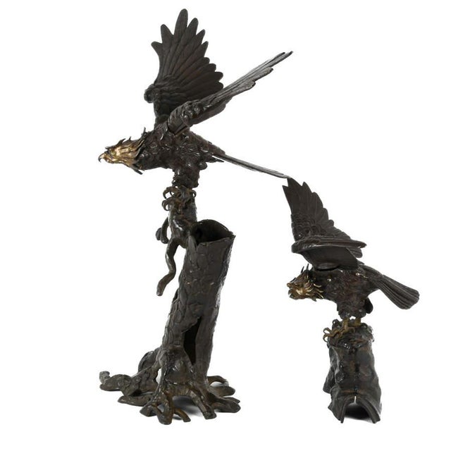 This oversized bronze eagle sculpture presents a powerful wildlife composition, featuring a large eagle perched...