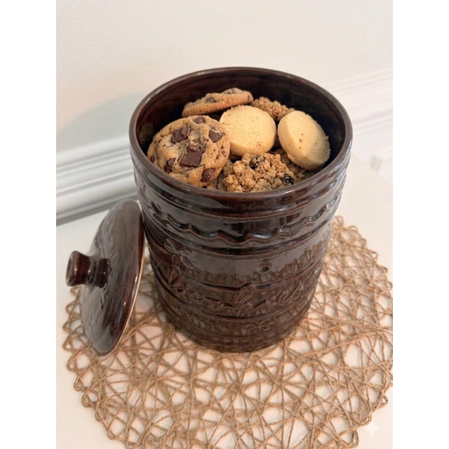 Charming vintage Mar-Crest oven-proof stoneware cookie jar in rich glossy brown glaze with embossed “Cookies” lettering...