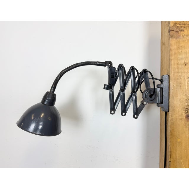 This vintage industrial adjustable gooseneck grey scissor wall light was produced by Elektroinstala Dečín in former...