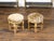 A pair of French giltwood stools from the 19th century, with fluted legs, cross stretchers and leopard style upholstery....