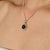 Crafted in 925 sterling silver, this stunning black star gemstone pendant features an 11.55 carat center stone with a...