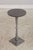 Age: Approx. 5 Years Old Details: Distinctive Tapered Metal Pedestal Base Sleek Dark Round Top Modern Brutalist Design...