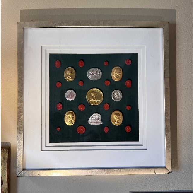 This elegant shadow box displays a curated collection of neoclassical intaglios and classical medallion casts. Arranged in...