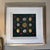 This elegant shadow box displays a curated collection of neoclassical intaglios and classical medallion casts. Arranged in...
