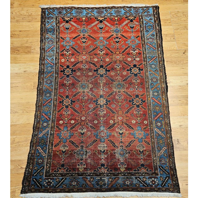 "This exquisite vintage Persian Malayer rug from the early 20th century features a striking allover geometric pattern...