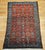 "This exquisite vintage Persian Malayer rug from the early 20th century features a striking allover geometric pattern...