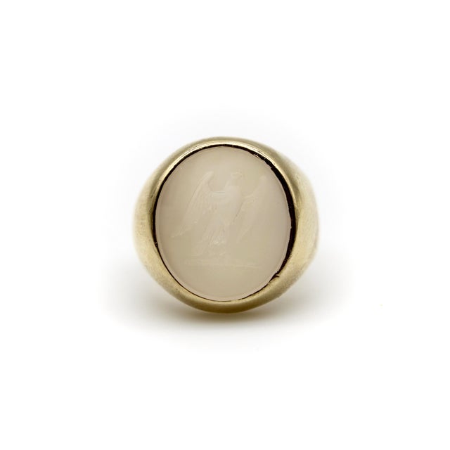 This 14k gold signet ring contains a beautifully carved white chalcedony intaglio carved with the image of an eagle. White...