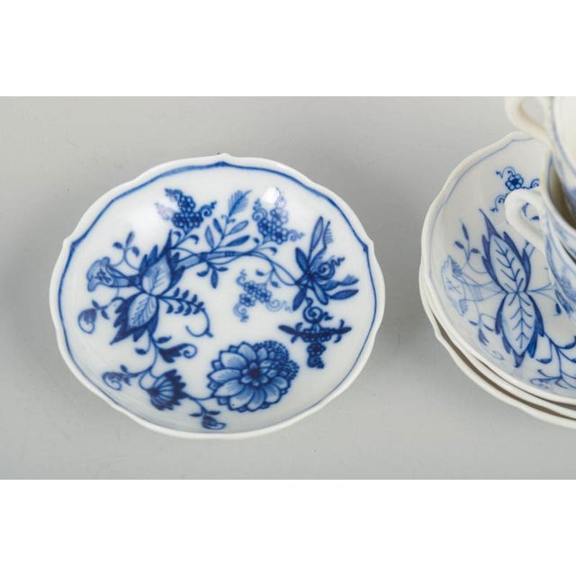 Meissen Blue Onion Pattern, four espresso cups with matching saucers. Set consisting of four espresso cups with matching...