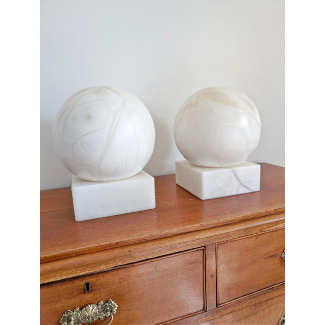 A pair of large vintage 1970s mid century modern white alabaster globe lamps. Hand crafted from the finest solid spanish...