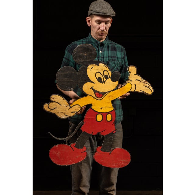 Pair of hand-painted plywood decorative wall figures depicting Mickey Mouse and Donald Duck in their familiar animated...