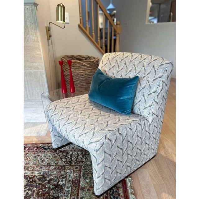 Elevate your space with this stunning, contemporary Arhaus Reyna chair, presented in the sophisticated "olive" colorway....