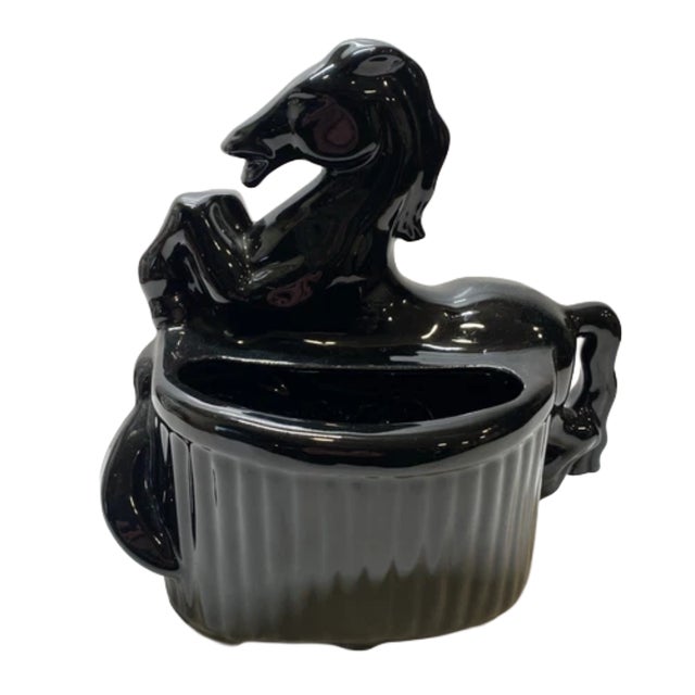 A striking blend of sculptural form and equestrian elegance, this vintage planter captures a rearing horse in dramatic...