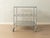 Timeless tunsta serving trolley by niels gammelgaard for ikea, 1999. Stainless steel frame on plastic casters with three...