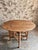 Vintage French gateleg table dating from approximately 1930–1950, featuring an oval top with folding drop leaves on both...