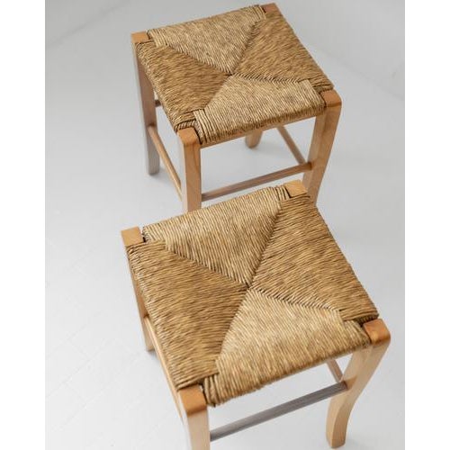 This vintage set of 2 wooden stools from the 1980s combines rustic charm with light, elegant craftsmanship. Made from...