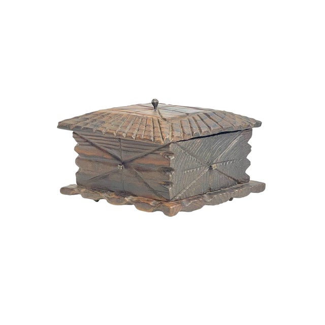 Beautifully handcrafted mid-20th century American folk art box featuring intricate carved geometric detailing throughout....