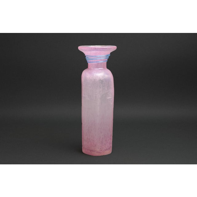 An iridescent pink scavo glass vase attributed to Archimede Seguso. The hexagonal form flares at the mouth and is accented...