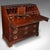 This is a rare antique barrister's bureau. An English, mahogany and boxwood fall-front writing cabinet or secretary with...