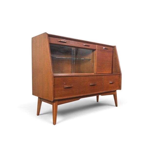 This early credenza was designed by E. Gomme and produced by E. Gomme Ltd, the makers of G Plan, in England during the...