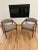 Mid Century pair of solid walnut side chairs in excellent condition. The chairs have been professionally reupholstered...